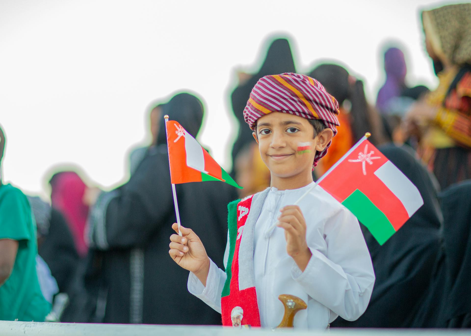 Young Arab Boy Holding Flags of Oman