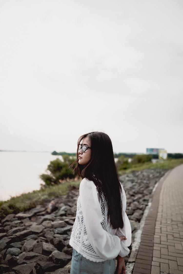 Woman In White Crochet Top Looking At The View