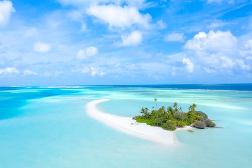 Beautiful Maldives Island Under a Cloudy Blue Sky