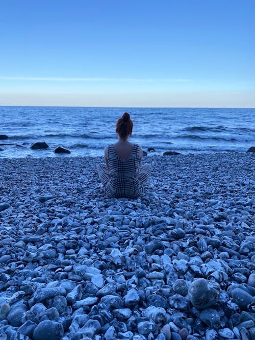 A Person Enjoying The Beach View of the Sunset · Free Stock Photo