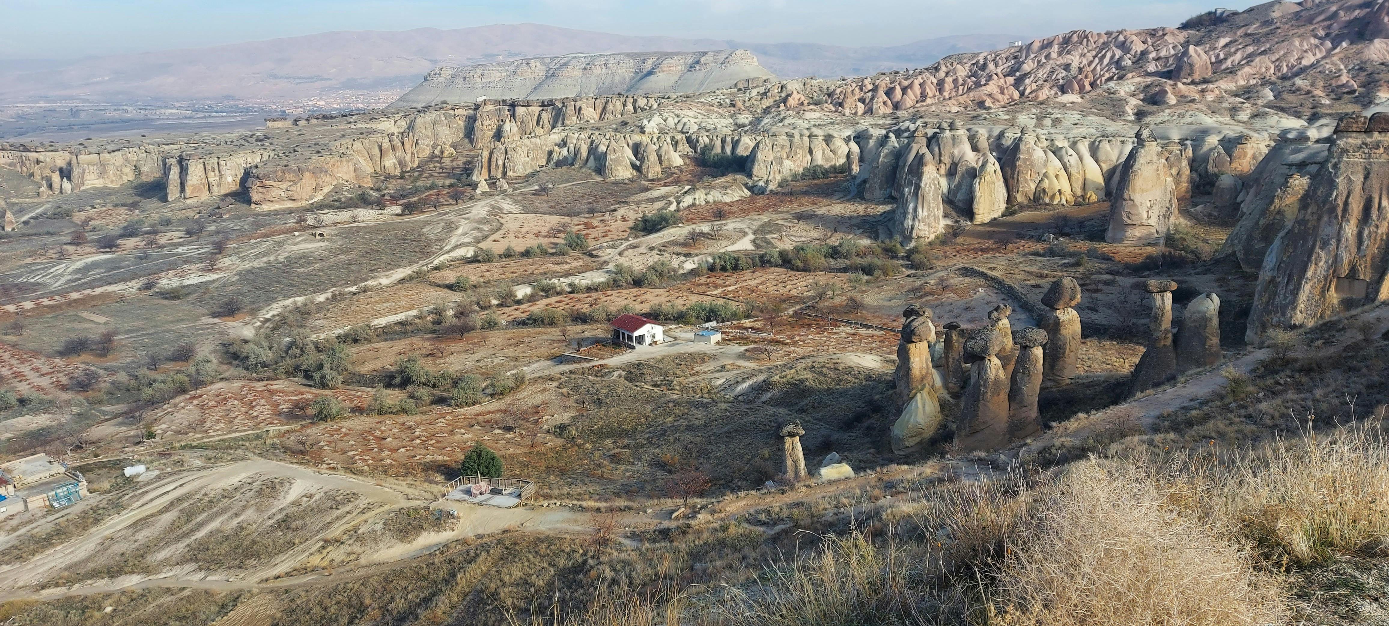 Explore the breathtaking aerial view of Cappadocia's iconic fairy chimneys and unique rock formations.