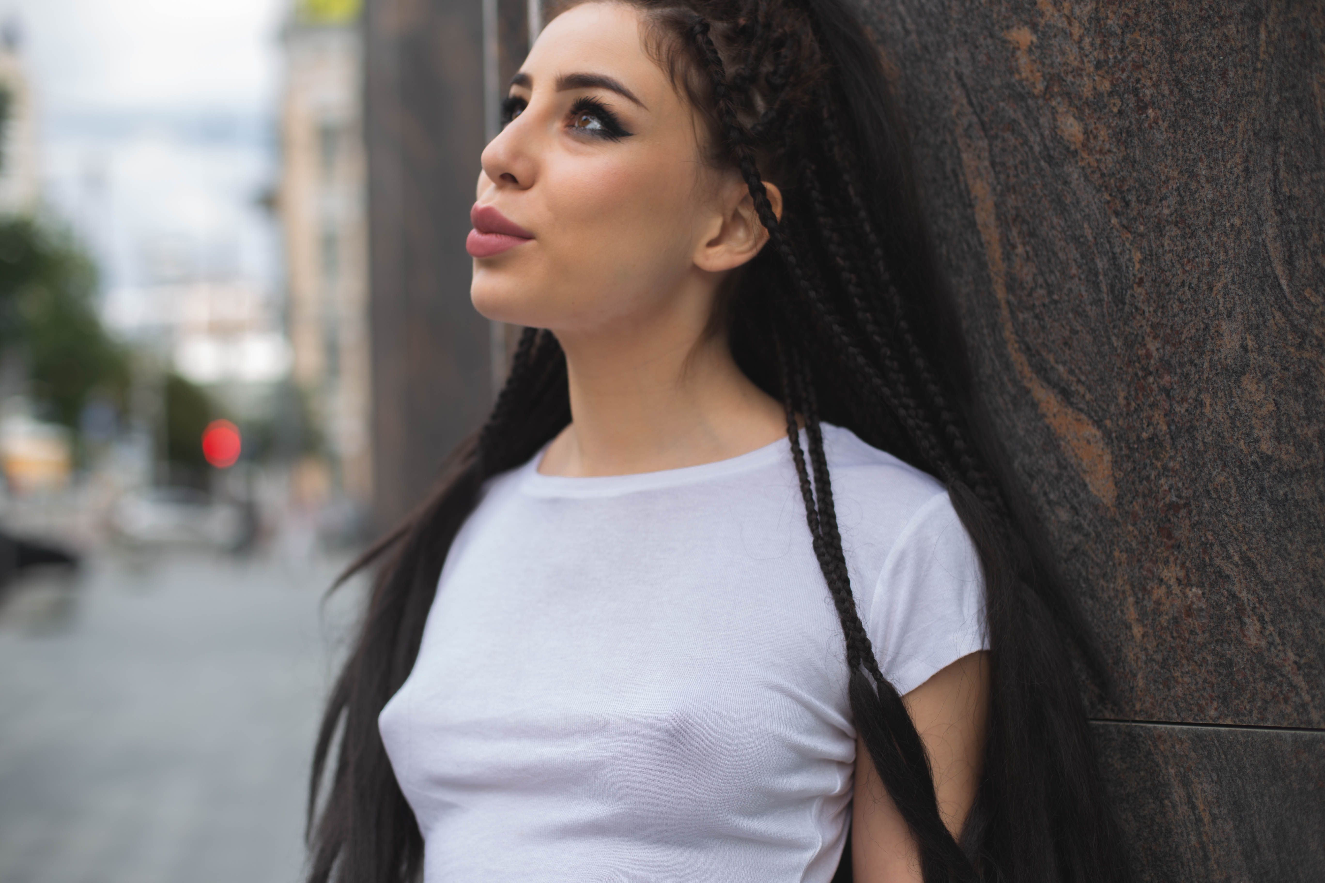 A Woman Standing in a City