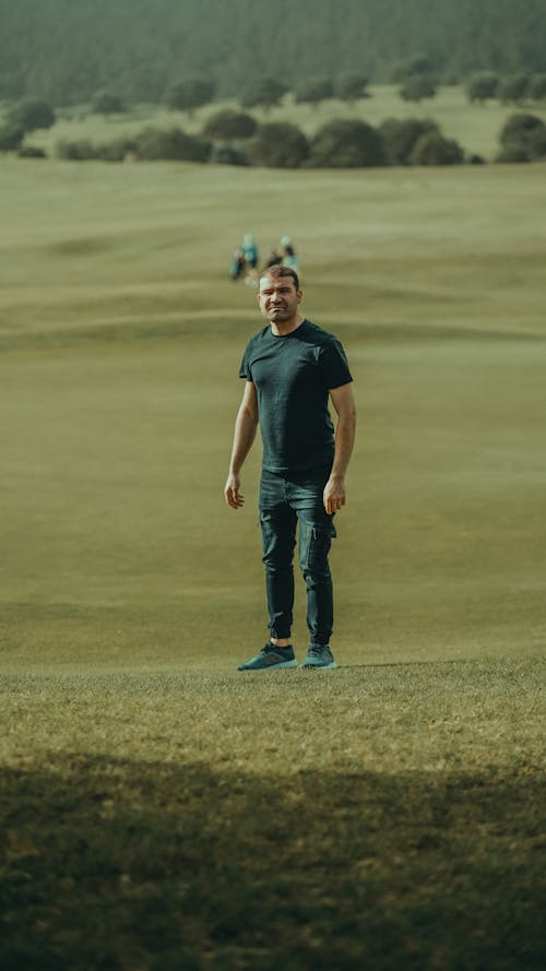 Man Standing on the Field