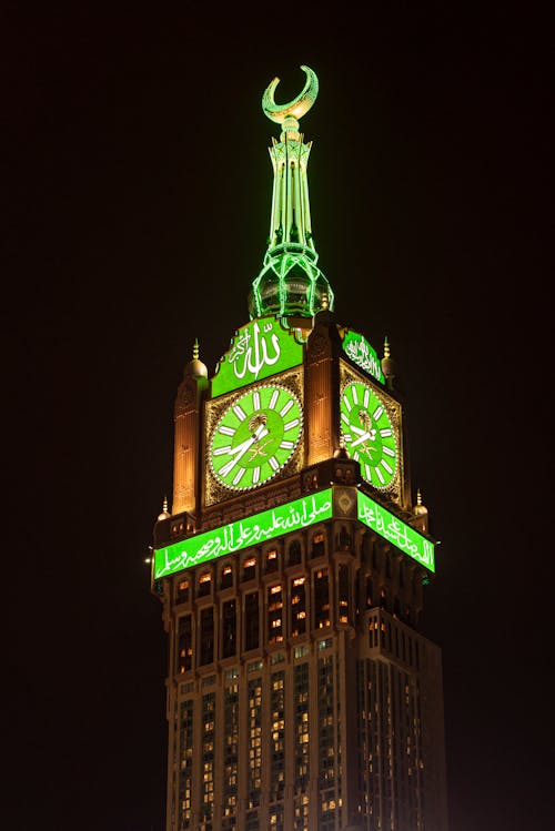 Photo of an Illuminating Makkah Royal Clock Tower at Night, Mecca, Saudi Arabia