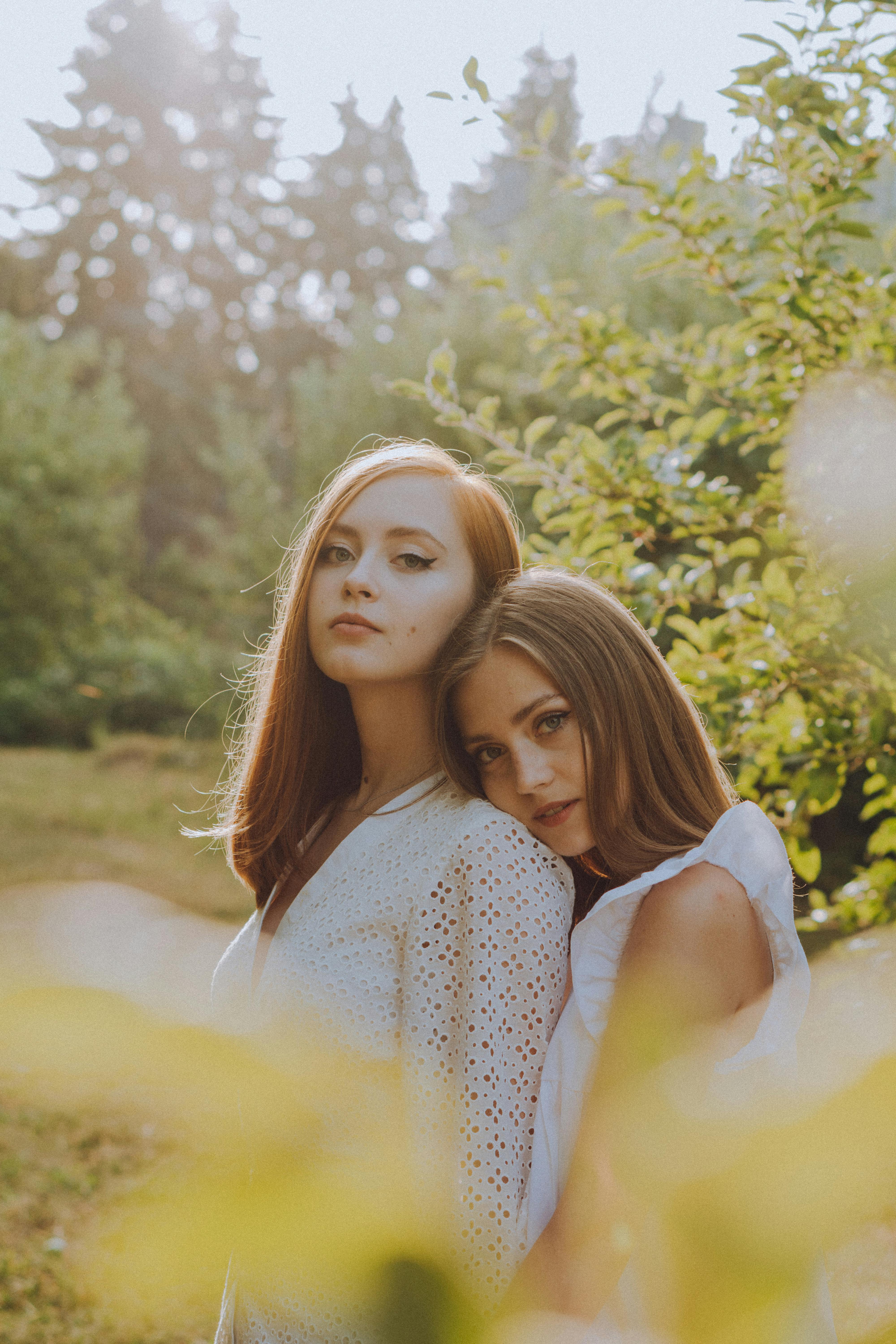 beautiful girls posing together in nature