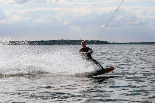 Free Man Riding a Wakeboard Stock Photo