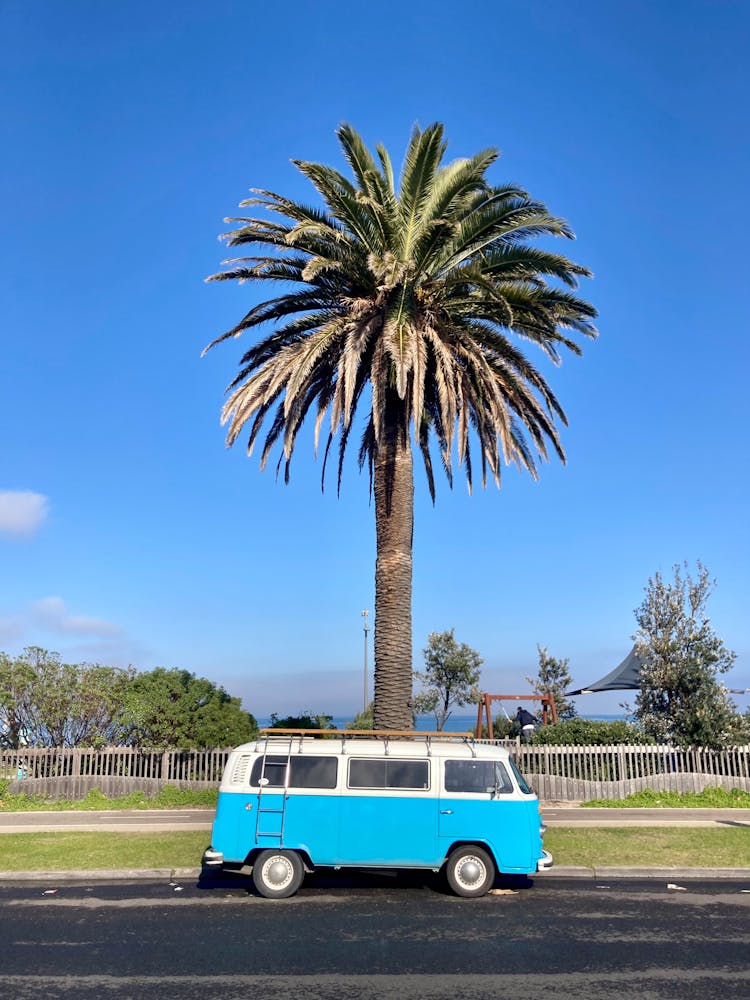 A Parked Blue And White Volkswagen Kombi Van