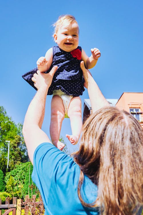 Woman Playing with Her Baby Girl