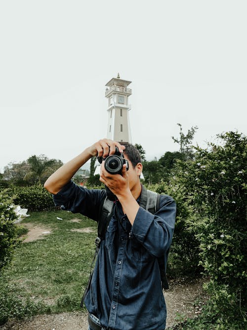 Man Taking Photo with a Camera