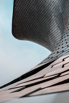 Architectural detail of Museo Soumaya's unique metallic facade in Mexico City.