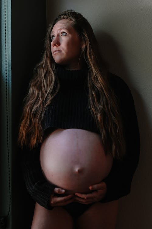 Free Pregnant Woman Looking Up Stock Photo
