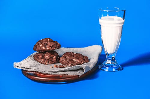 Free A Delicious Chocolate Cookies and a Glass of Milk Stock Photo