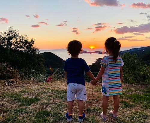 Back View of a Girl and Boy Doing Holding Hands