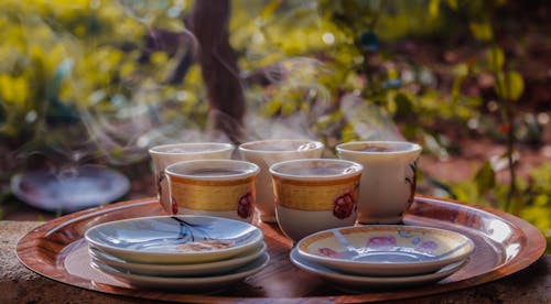 Free Cups and Saucers on Round Brown Tray Stock Photo