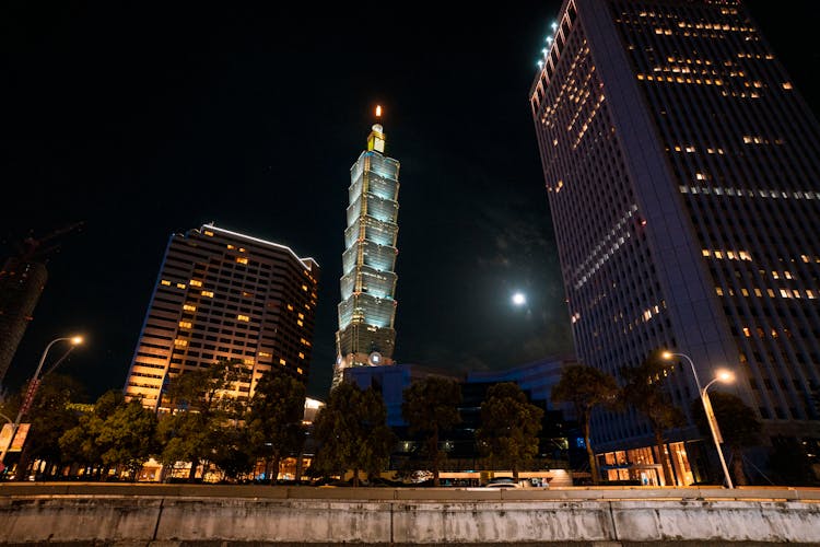 Low-Angle Shot Of High Rise Buildings In The City During Nighttime
