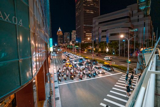 People Walking on Pedestrian Lane during Night Time