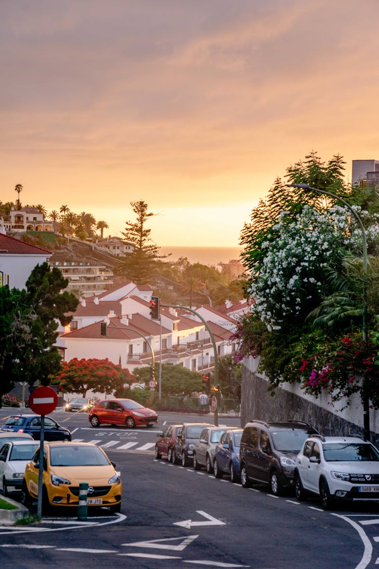 Photo Of A City Street With Cars At Sunrise