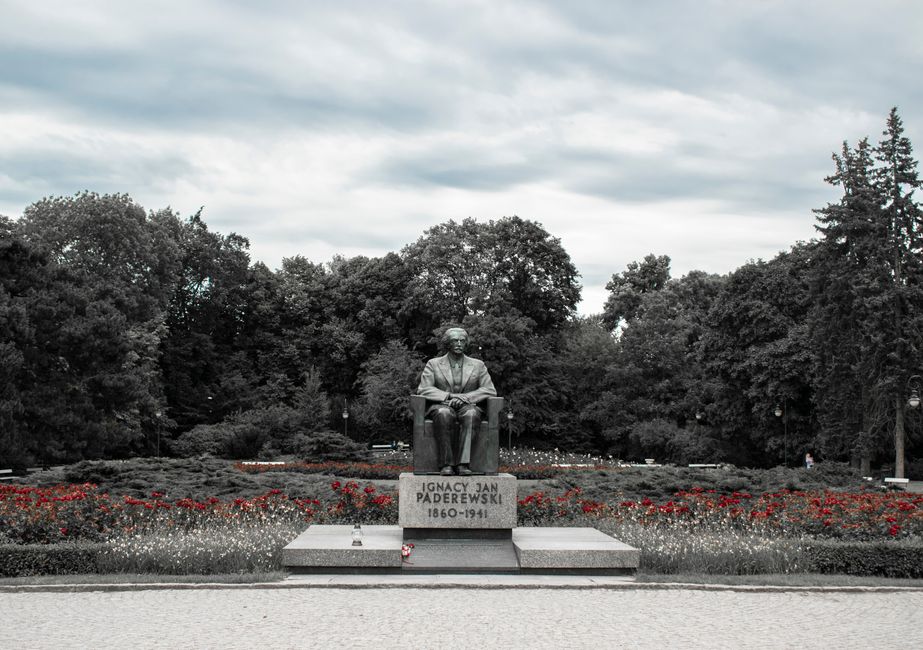 Monument of Ignacy Jan Paderewski surrounded by trees in Warsaw park, Poland.