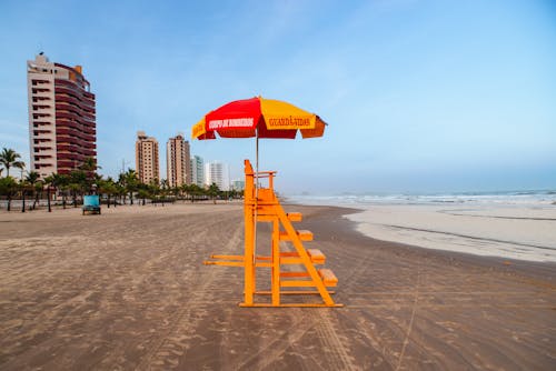 Free Lifeguard Posy on Beach Shore Stock Photo