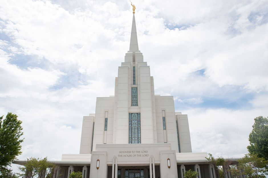 A striking view of the Rexburg Idaho LDS Temple with a dramatic cloudy sky backdrop. Ideal for architecture and travel themes.