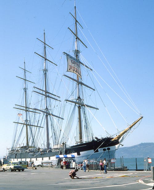 Large Ship Docked Under Blue Sky