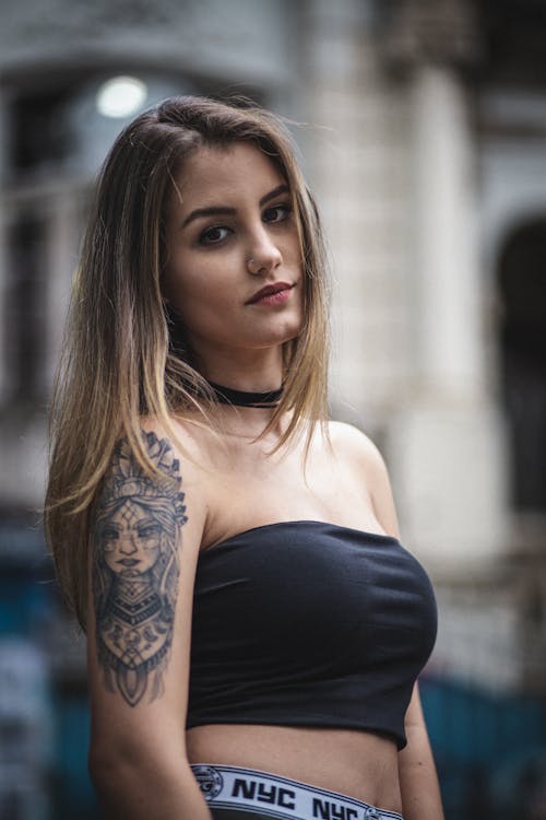 Portrait of Beautiful Young Woman with Tattoo