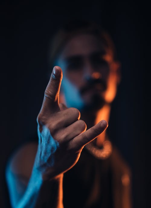 Man Showing the Sign of the Horns