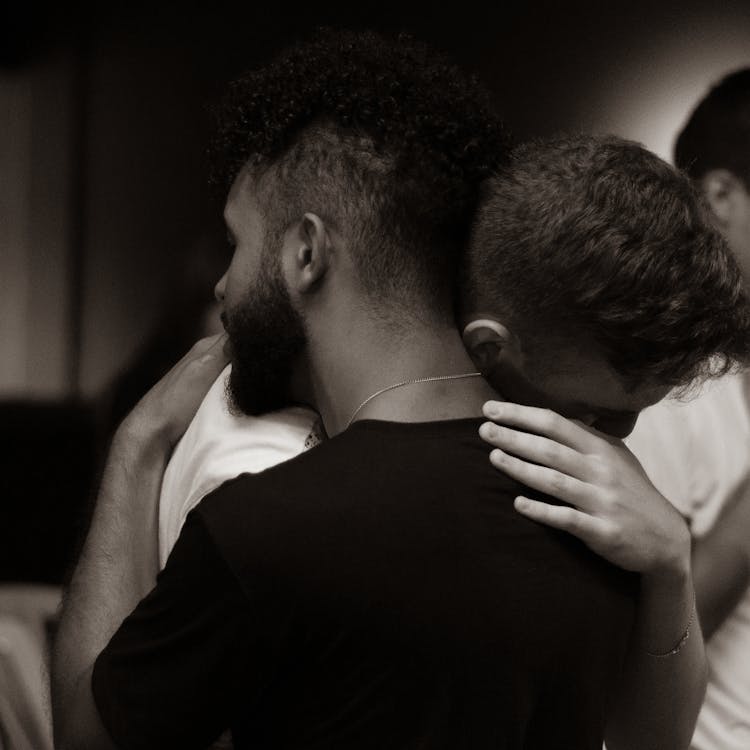 Men Hugging Showing Support