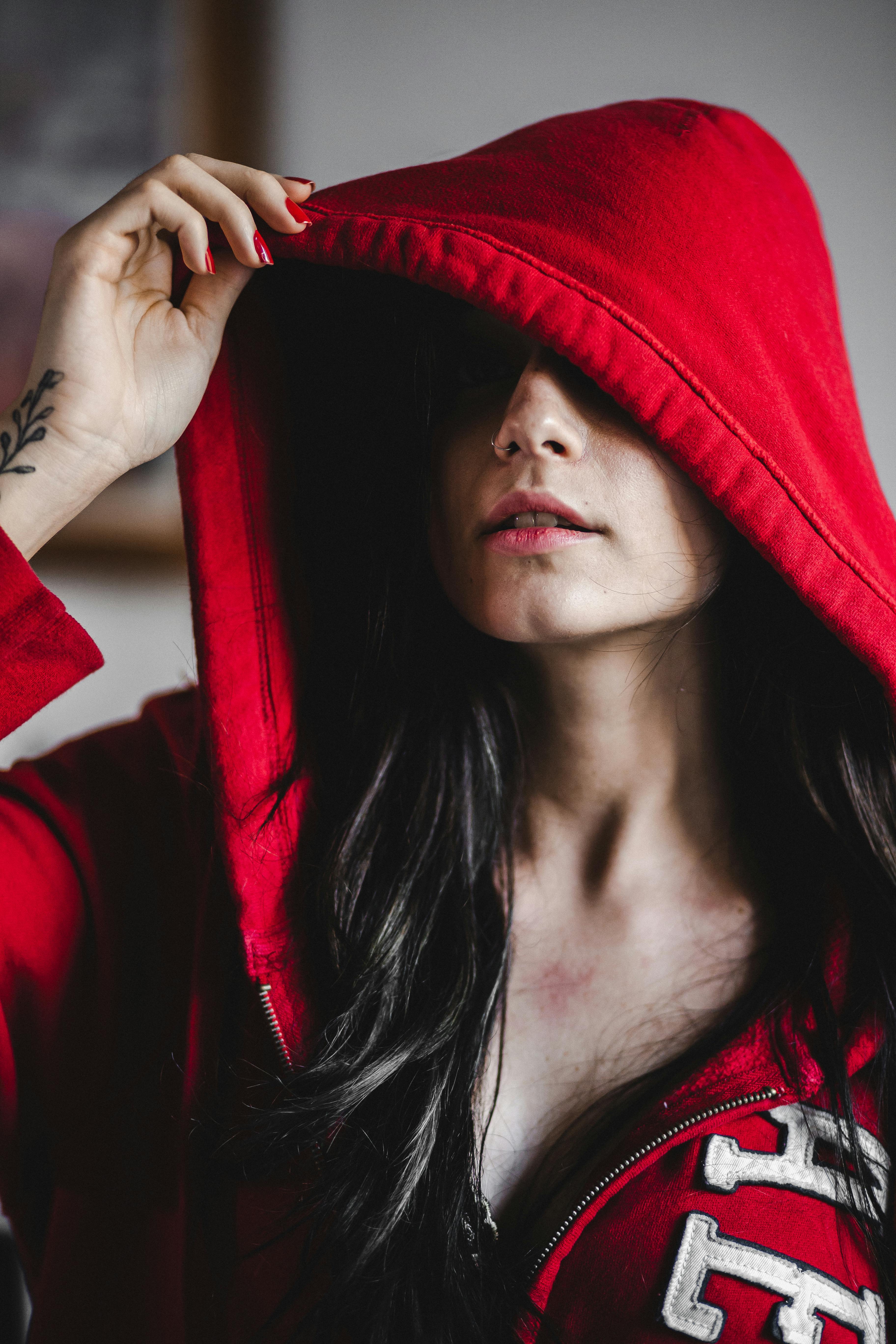 Close Up Shot of a Woman Wearing Red Hoodie Free Stock Photo