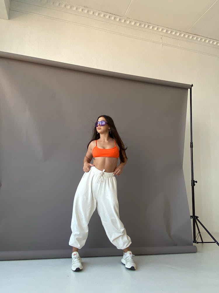 A Woman Standing In A Studio