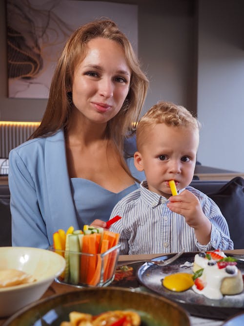 A Woman and her Son at a Dining Table