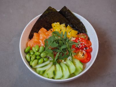 Poke bowl with salmon and vegetables — photo by Nadin Sh on Pexels