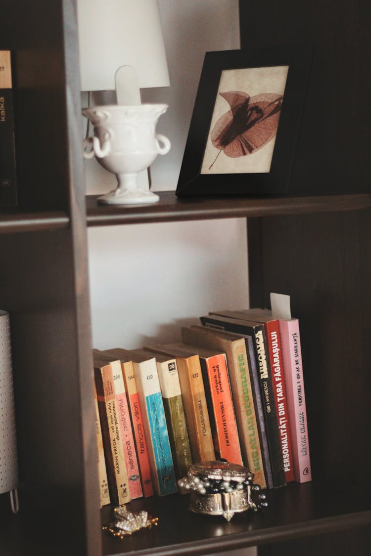 Frame And Books On The Shelves