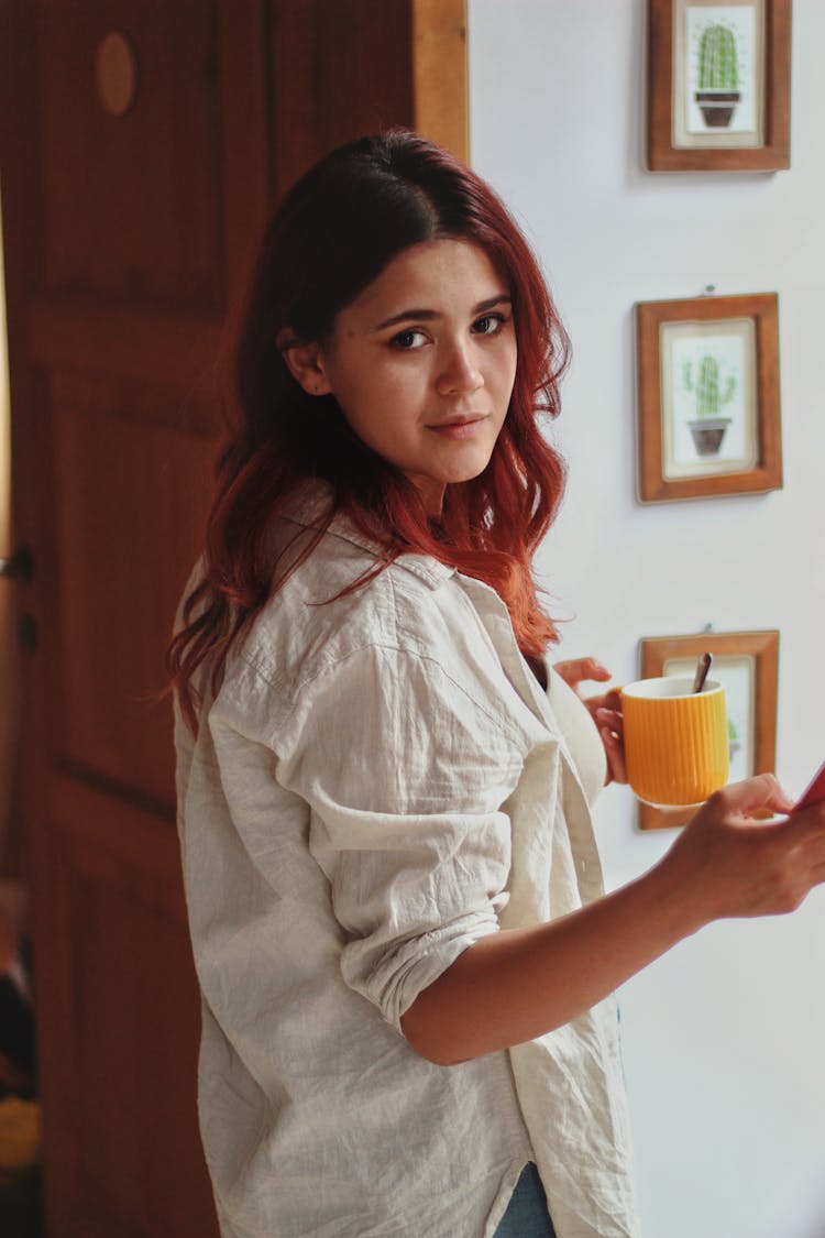 A Woman Holding A Mug