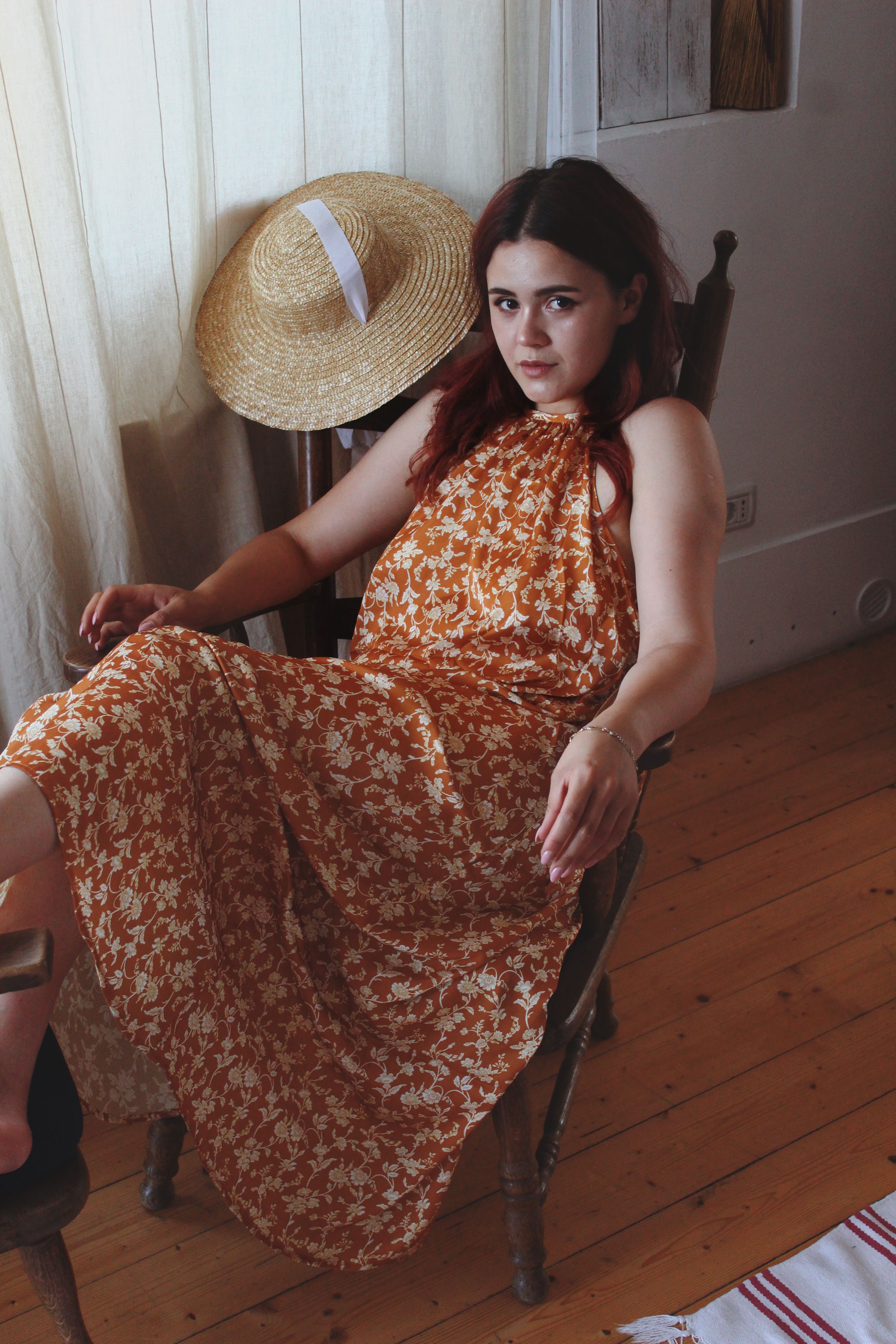 Woman in Brown Dress Sitting on a Chair with Legs Up · Free Stock Photo