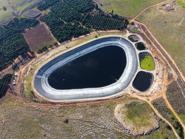 Bird's-eye View Of A Reservoir In A Farm