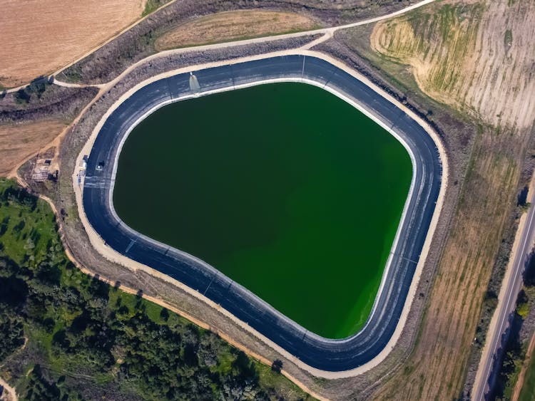 Bird's Eye View Of Water Reservoir For Irrigation In Agriculture