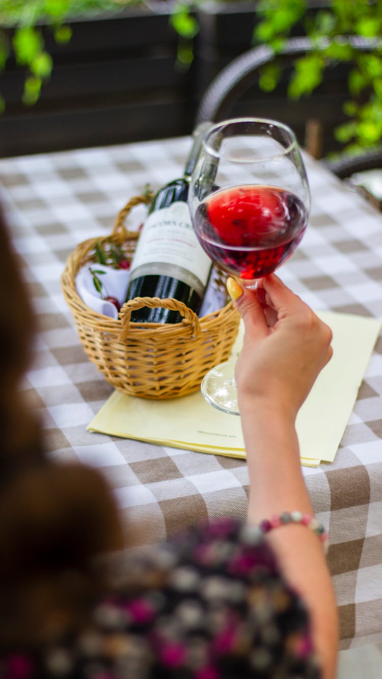 Woman Holding A Glass Of Red Wine 