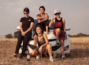 Four People Leaning on White Car