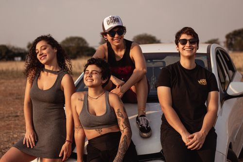 Free A group of friends smiling and enjoying a sunny day outdoors in Campinas, Brazil. Stock Photo