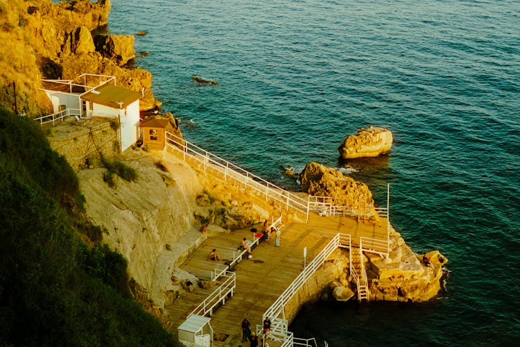 People On Sea Coastline