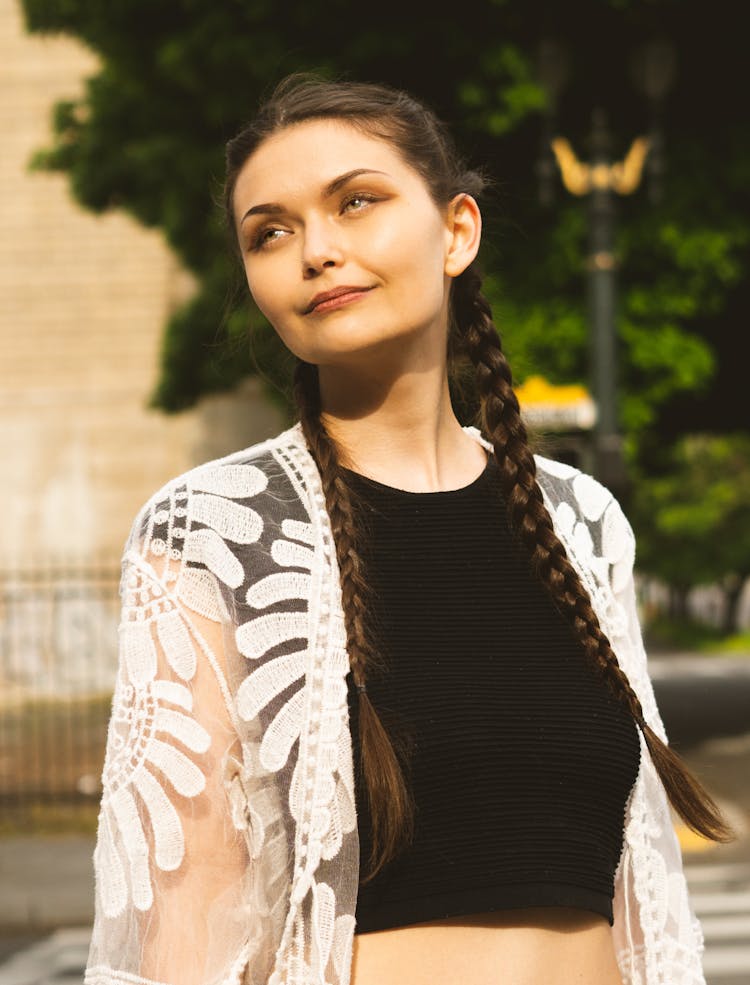 Portrait Of Brunette With Long Braids