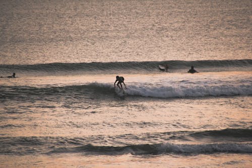 Person Surfing on the Sea Waves