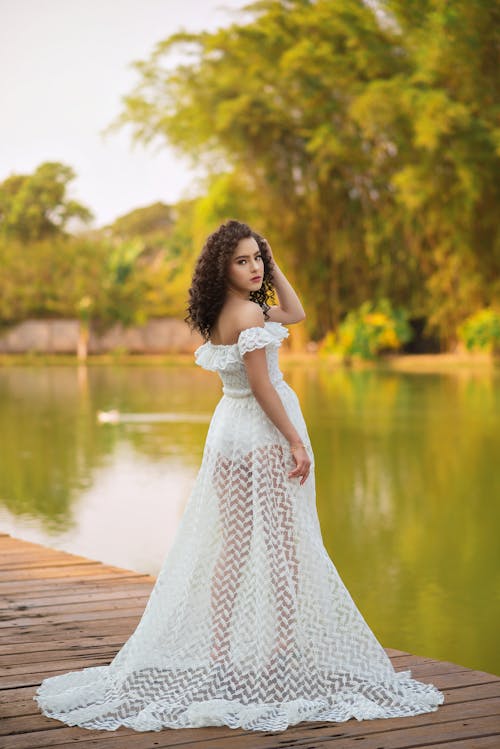 Back View of a Woman Wearing White Gown