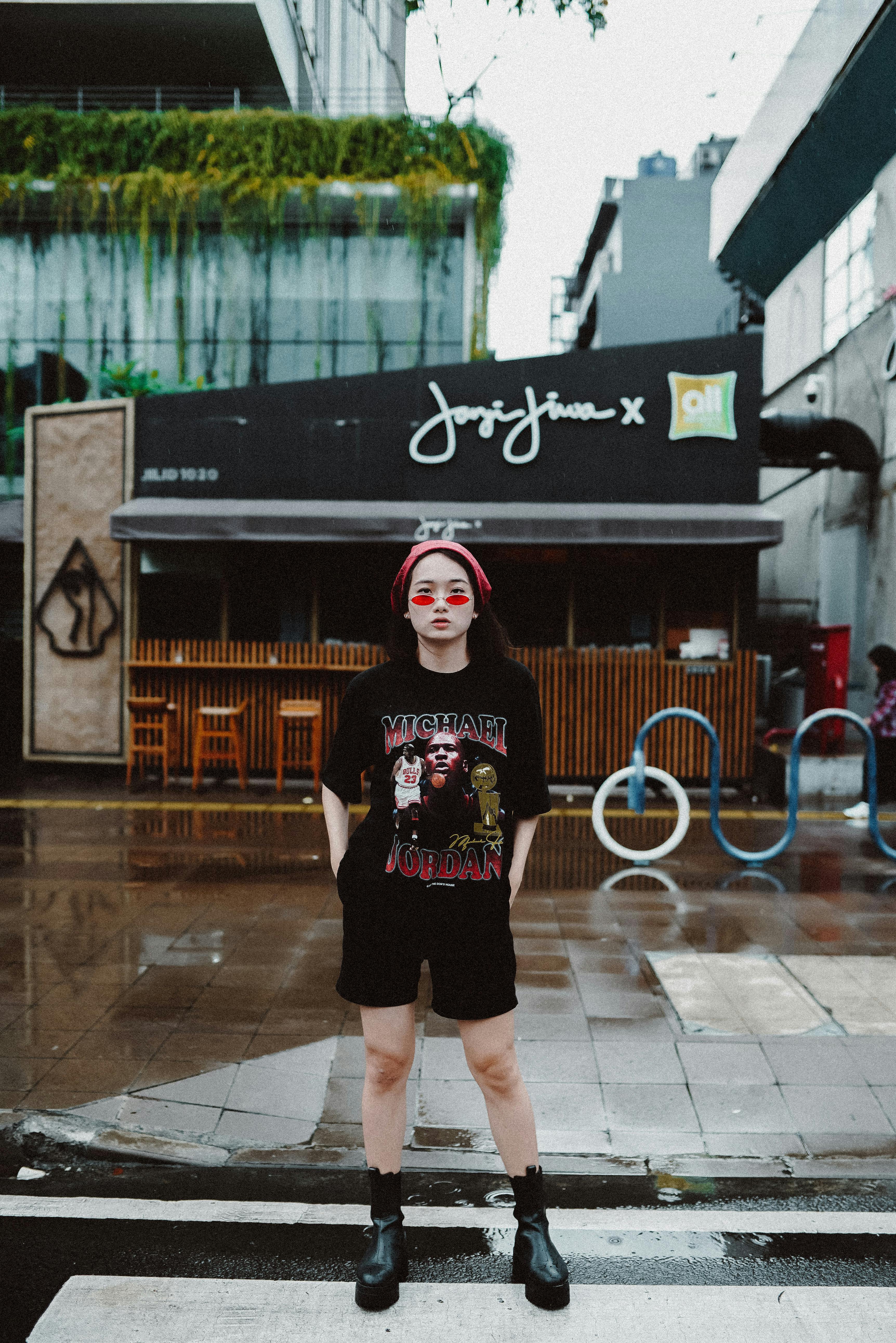 Fashionable individual in urban environment, showcasing city street style.