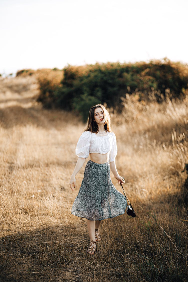 Woman Presenting Summer Fashion In Countryside
