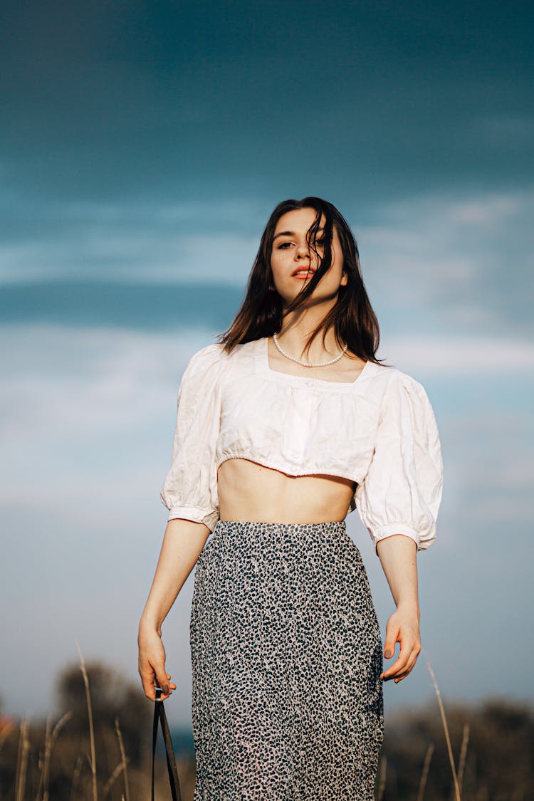 Brunette In Puff Blouse And Long Skirt