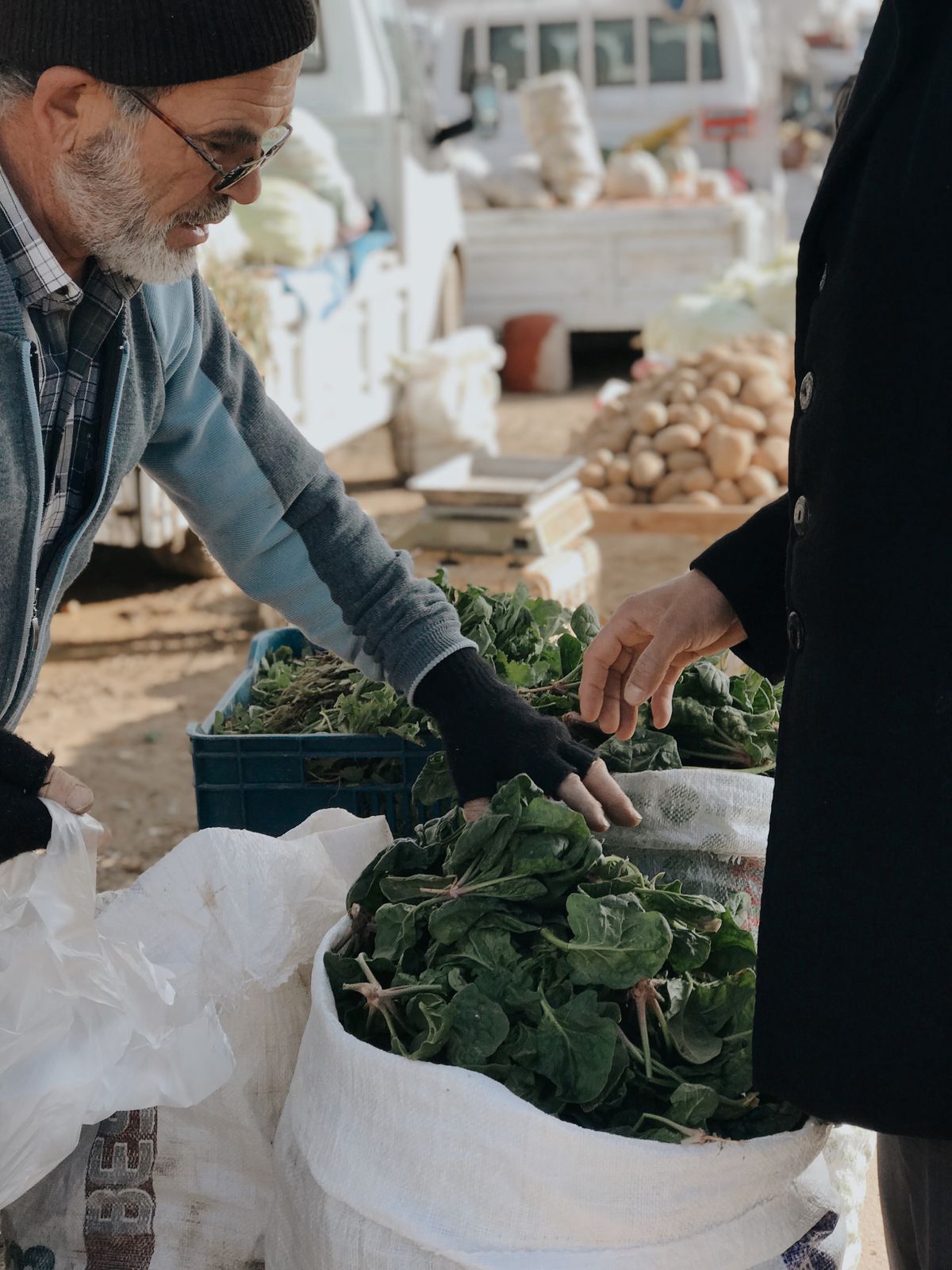 An outdoor market stall with fresh produce
