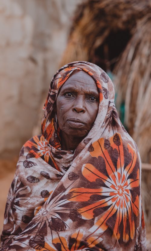 Elderly Tribal Woman in Floral Headscarf