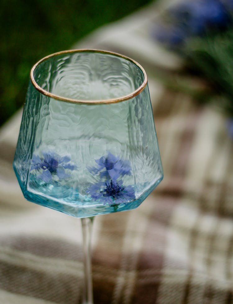 Blue Flowers In Wineglass